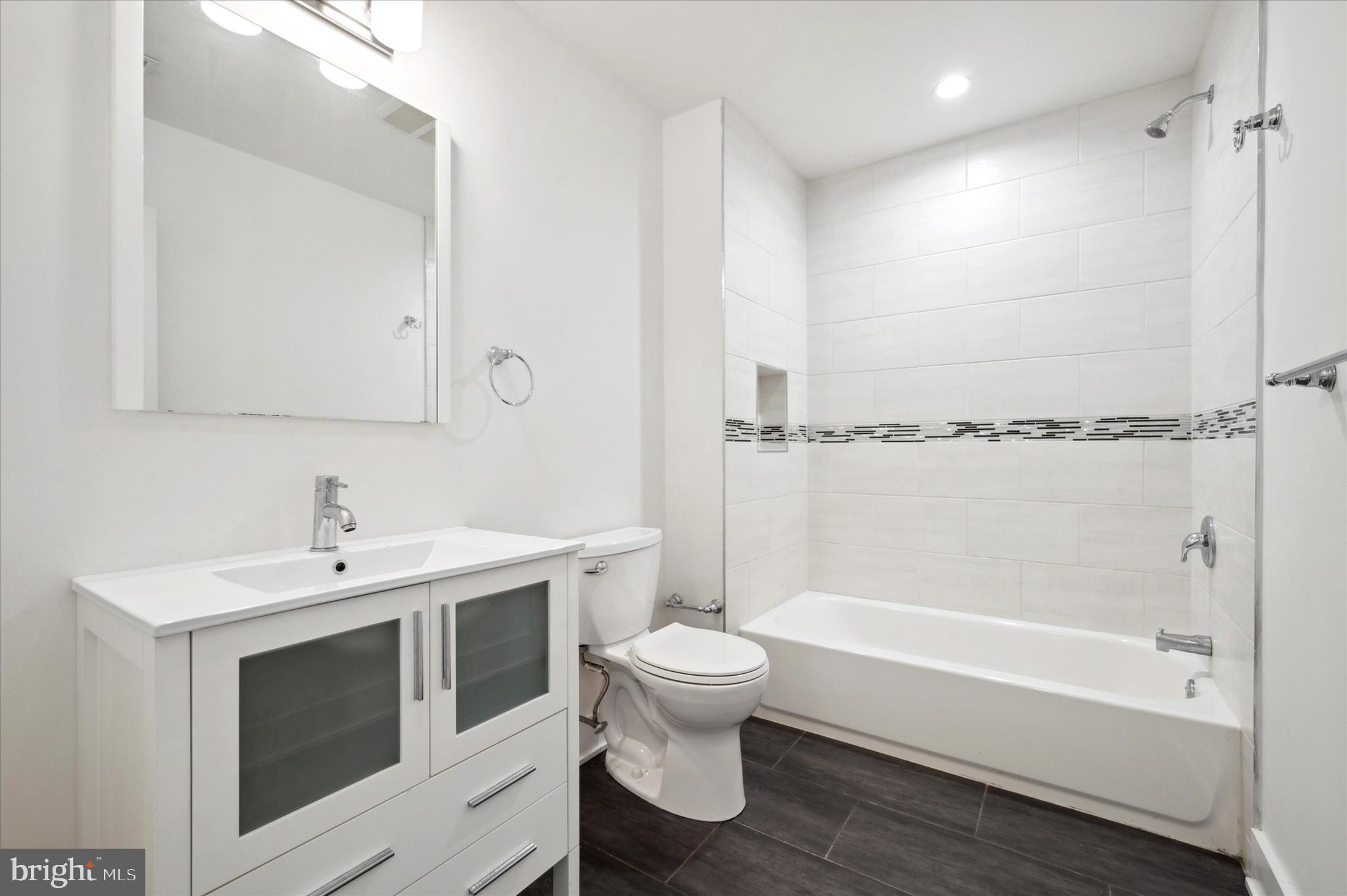1219 North 5th Street, Unit 2 Philadelphia, PA 19122 - Photo 10 of 16 a bathroom with a sink a toilet and bathtub