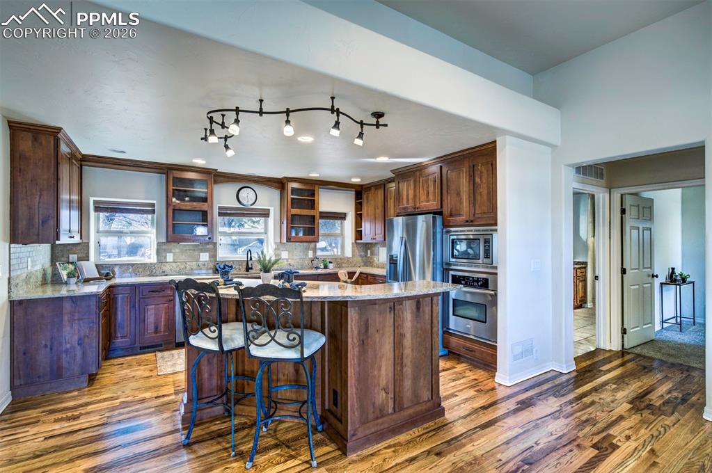 1905 Mesa Road Colorado Springs, CO 80904 - Photo 13 of 44 a view of a dining room with furniture and wooden floor