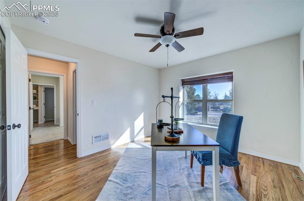 1905 Mesa Road Colorado Springs, CO 80904 - Photo 19 of 44 a view of a dining room with furniture window and wooden floor