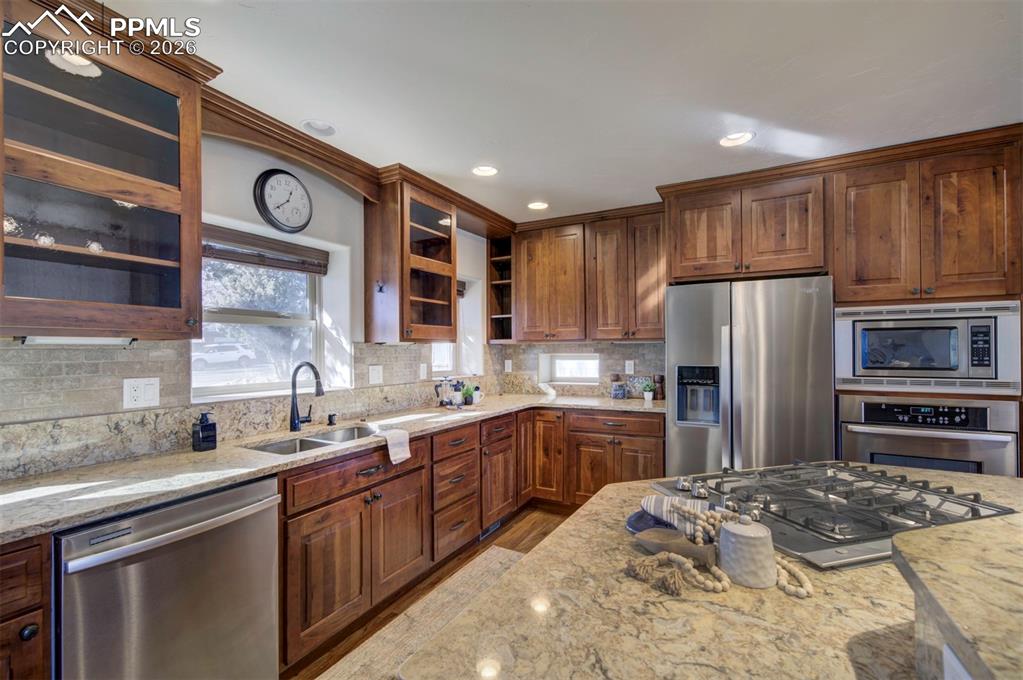 1905 Mesa Road Colorado Springs, CO 80904 - Photo 5 of 44 a kitchen with stainless steel appliances granite countertop a sink stove and refrigerator