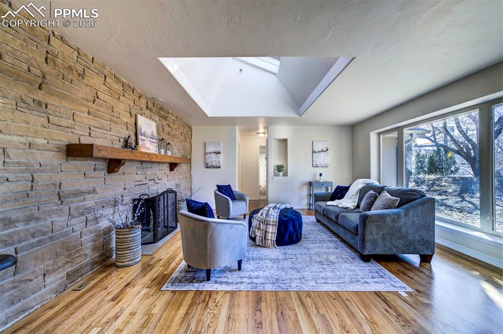 1905 Mesa Road Colorado Springs, CO 80904 - Photo 9 of 44 a living room with furniture and a fireplace