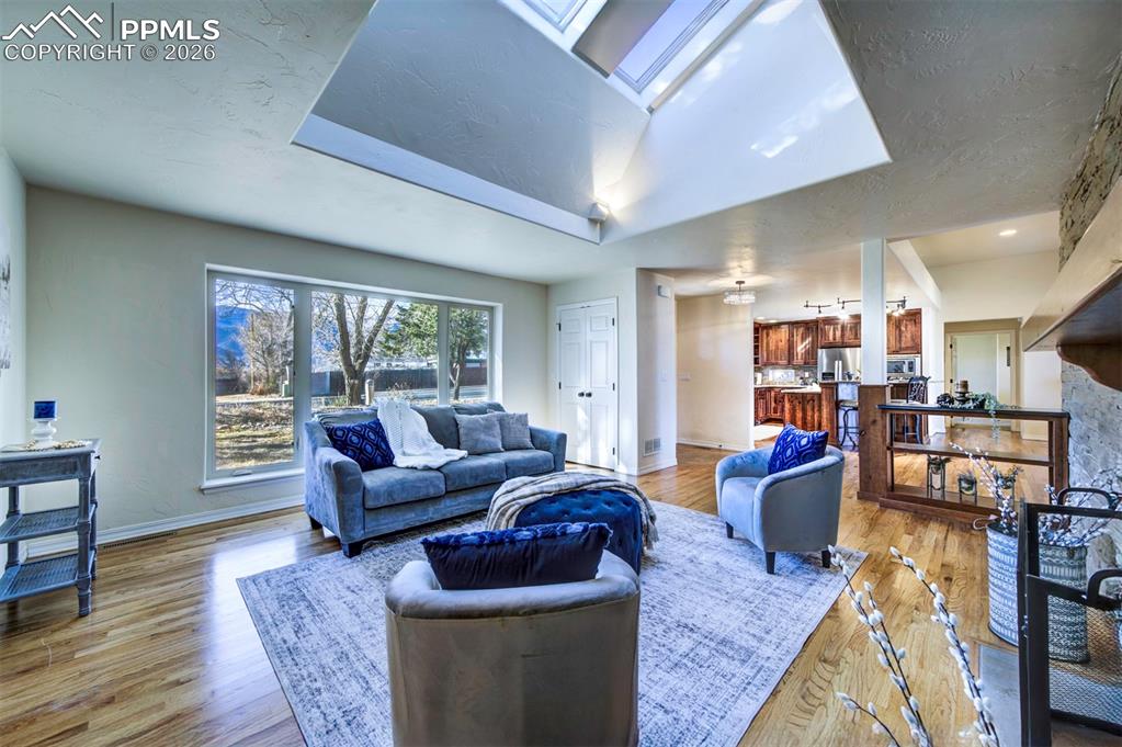 1905 Mesa Road Colorado Springs, CO 80904 - Photo 10 of 44 a living room with furniture and a large window