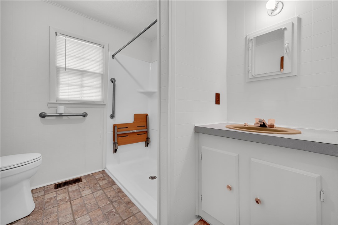 952 Stephens Drive Westminster, SC 29693 - Photo 32 of 50 Full bathroom offering a walk-in shower with a built-in seat and a practical vanity.
