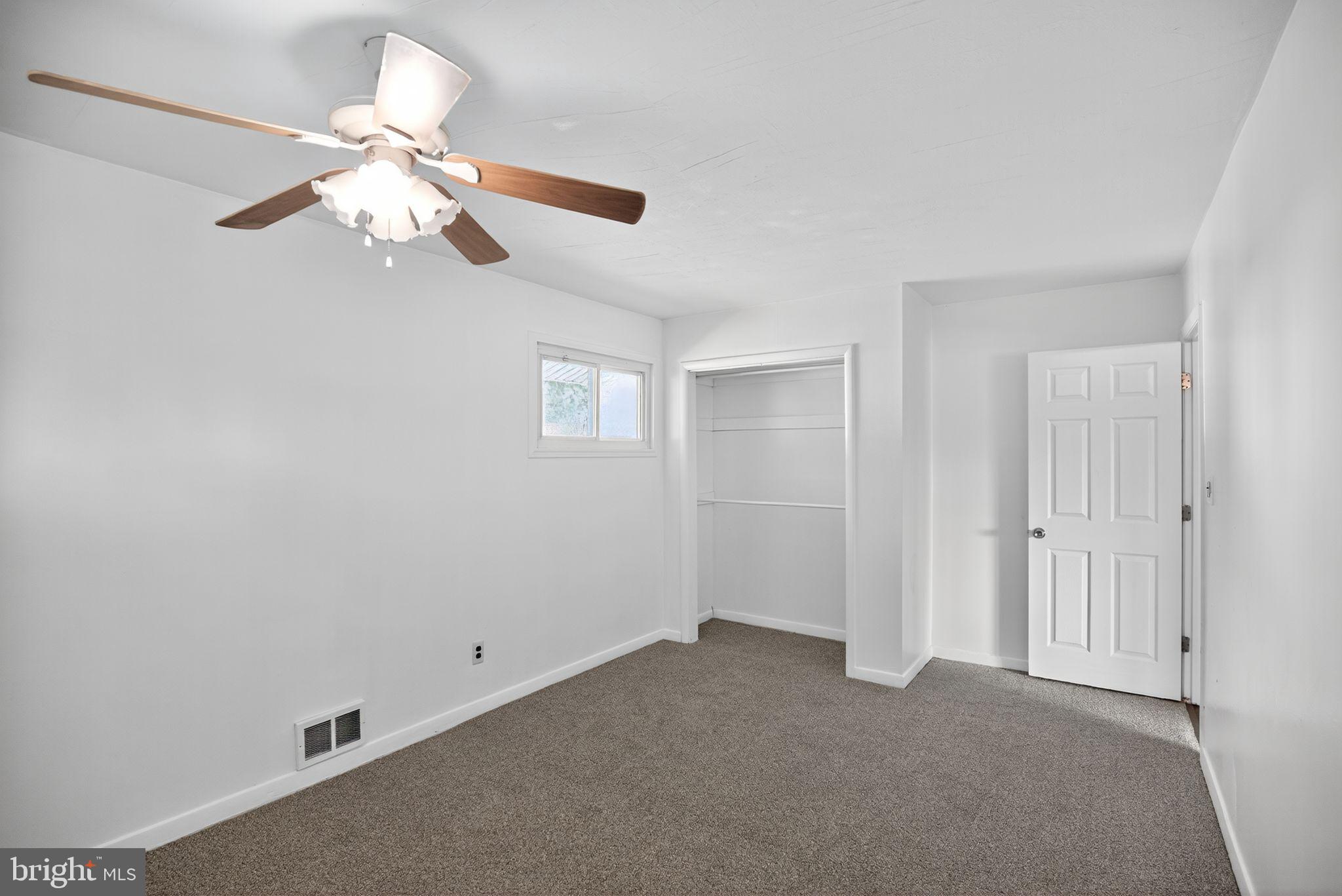 11 La Gorce Boulevard Burlington, NJ 08016 - Photo 15 of 22 a view of an empty room with a fan
