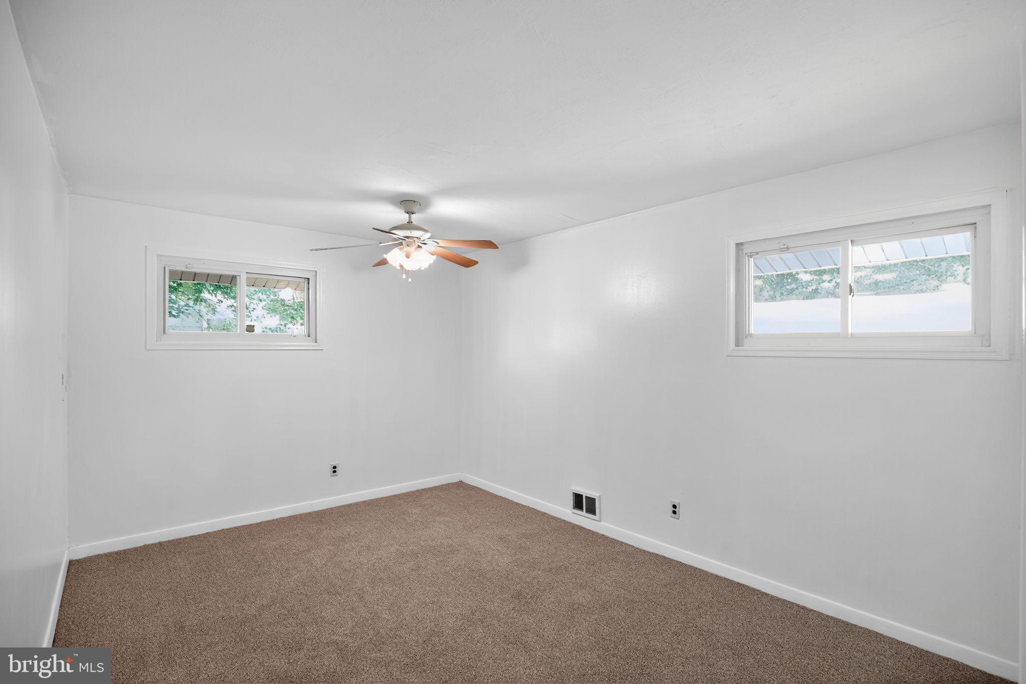 11 La Gorce Boulevard Burlington, NJ 08016 - Photo 16 of 22 an empty room with windows and fan