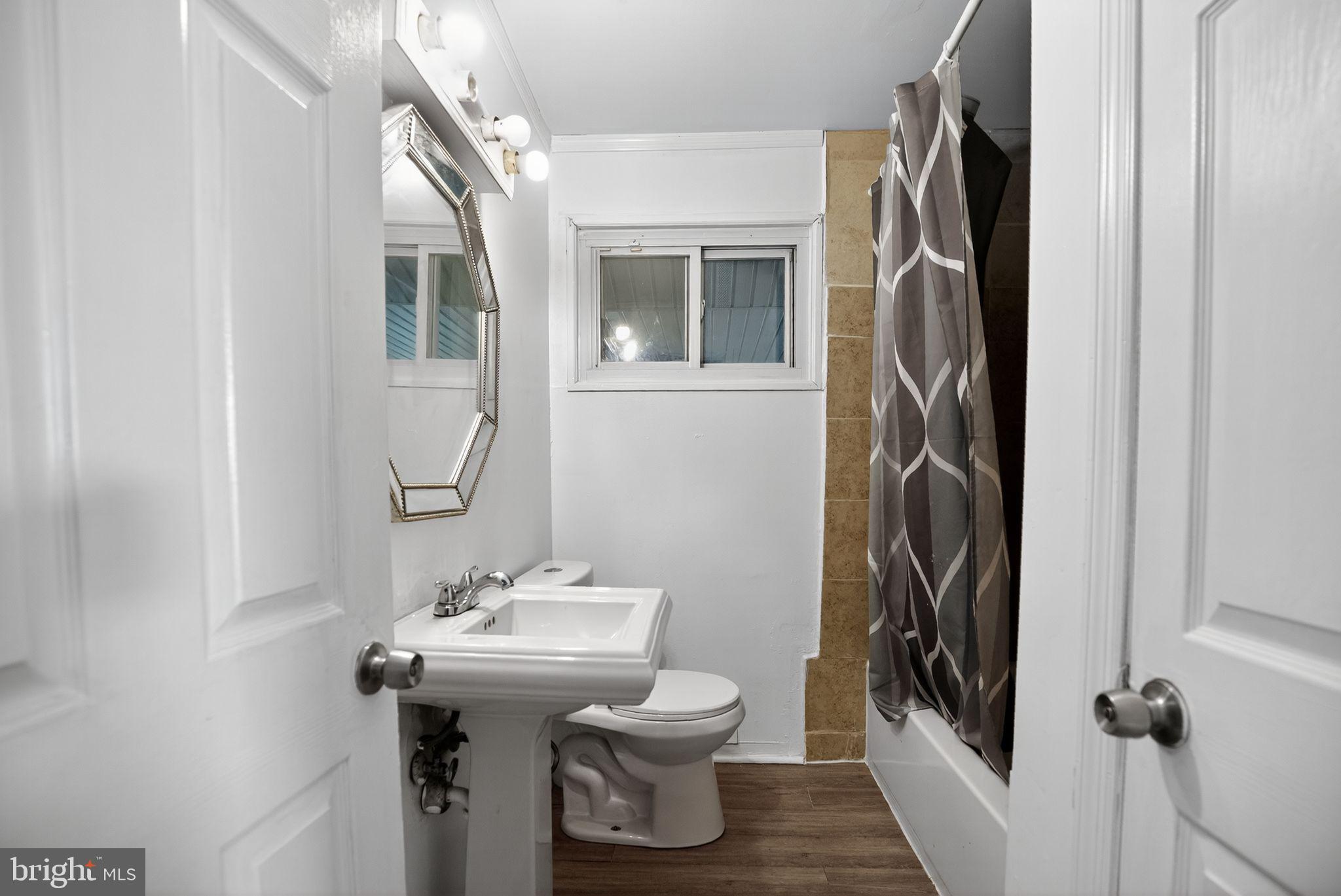 11 La Gorce Boulevard Burlington, NJ 08016 - Photo 17 of 22 a bathroom with a sink toilet and shower