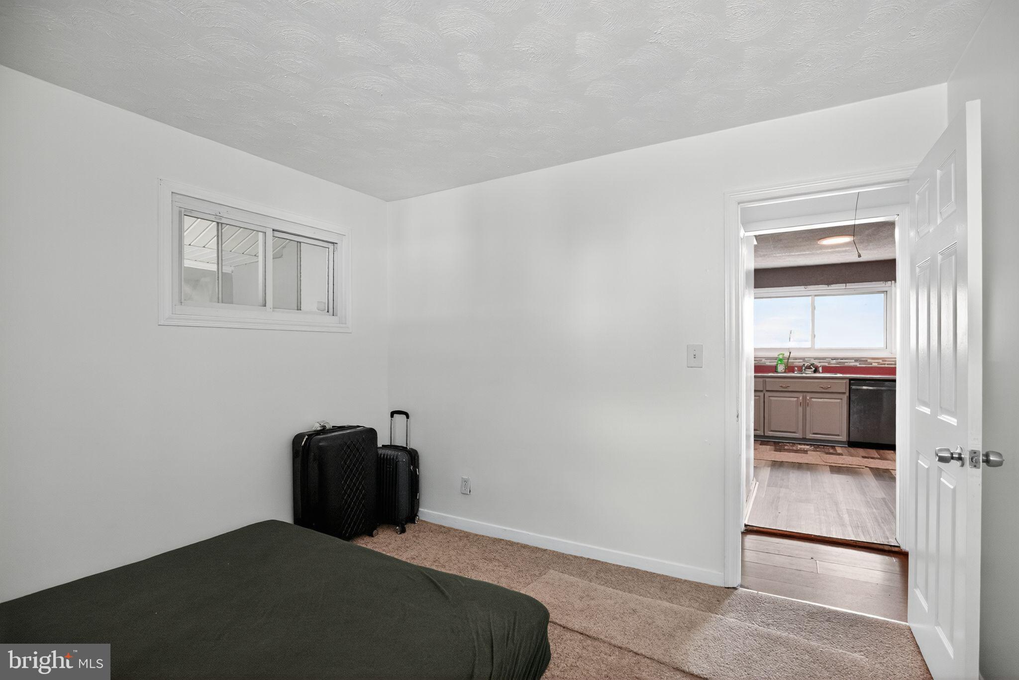11 La Gorce Boulevard Burlington, NJ 08016 - Photo 20 of 22 a bedroom with a bed and wooden floor
