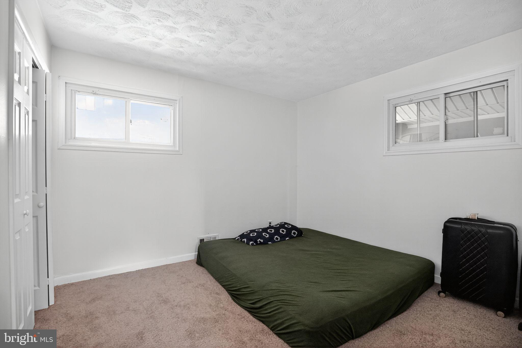 11 La Gorce Boulevard Burlington, NJ 08016 - Photo 21 of 22 a bedroom with a bed and a window