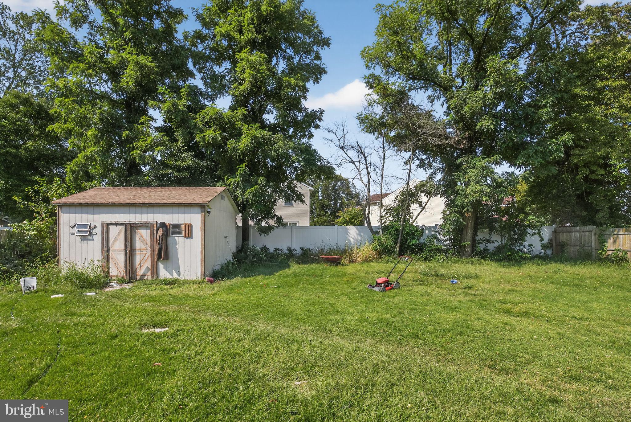 11 La Gorce Boulevard Burlington, NJ 08016 - Photo 22 of 22 a backyard of a house with lots of green space