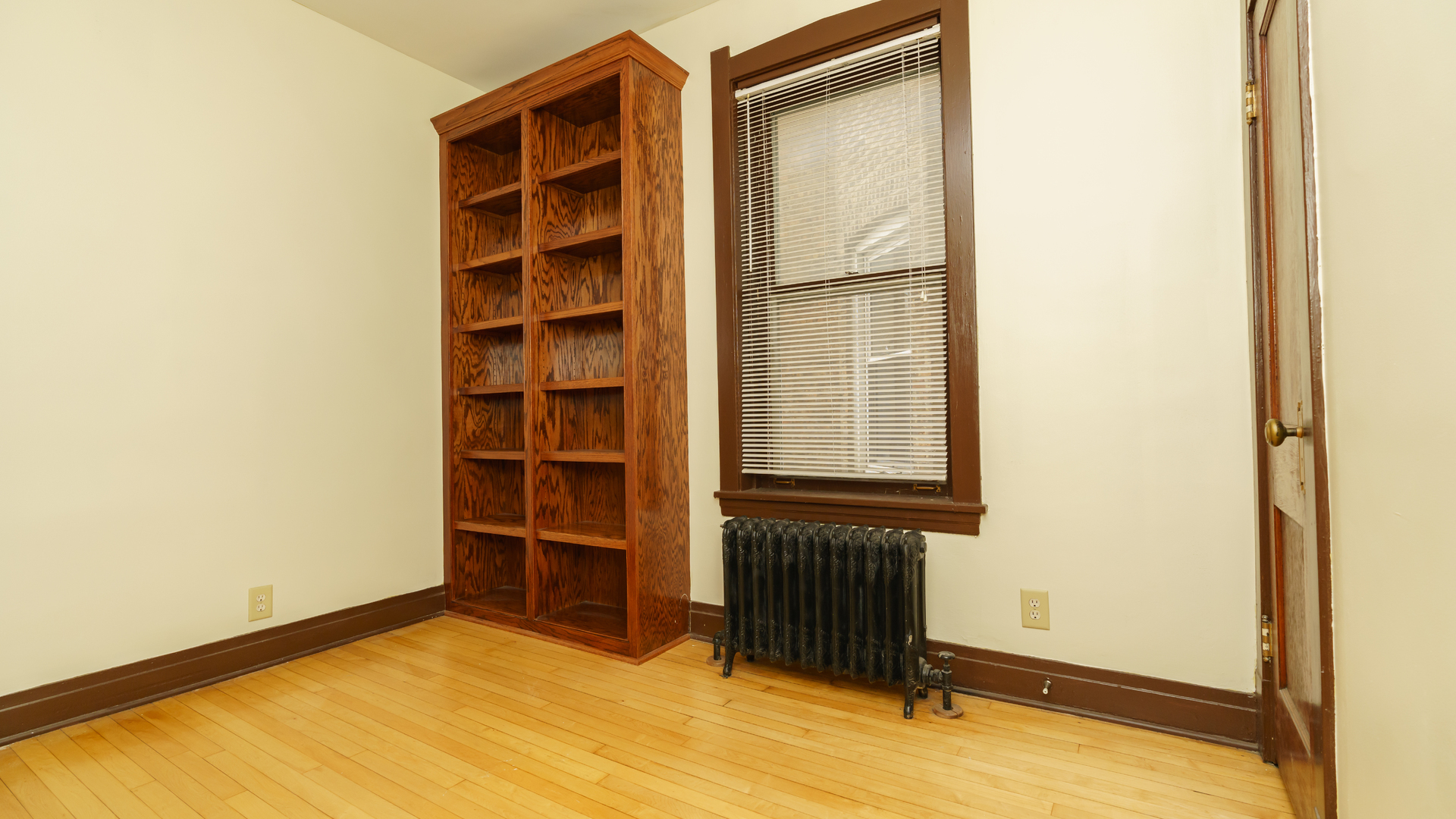 2644 North Harding Avenue Chicago, IL 60647 - Photo 14 of 37 a view of an empty room with wooden floor and a window