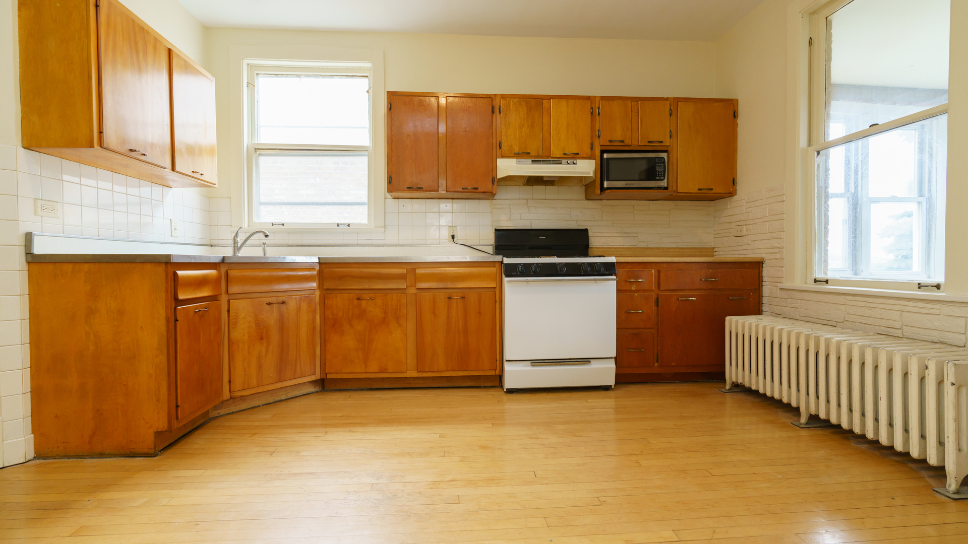 2644 North Harding Avenue Chicago, IL 60647 - Photo 21 of 37 a kitchen with stainless steel appliances granite countertop a sink stove and refrigerator