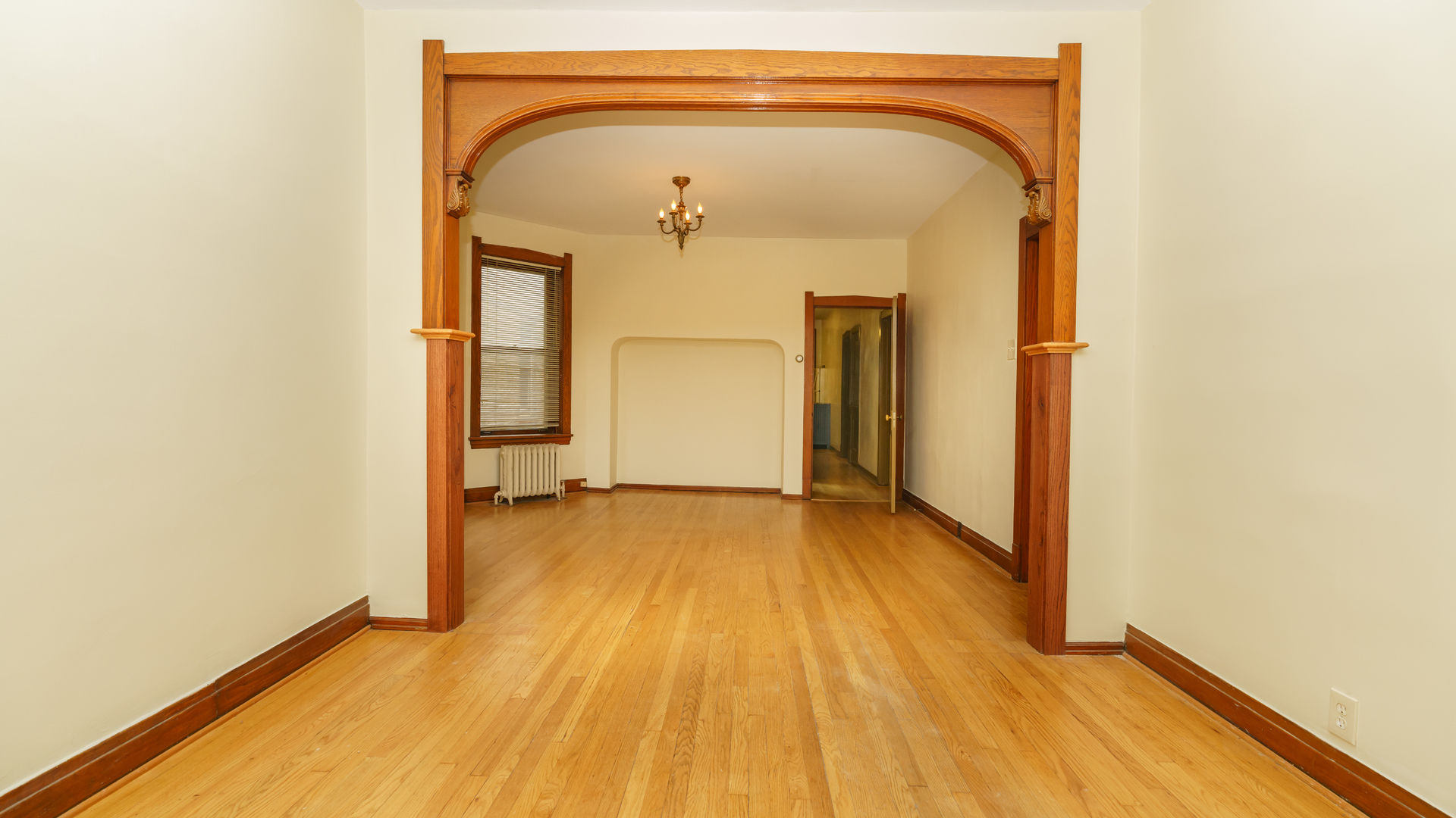 2644 North Harding Avenue Chicago, IL 60647 - Photo 4 of 37 a view of a hallway with wooden floor and a hallway