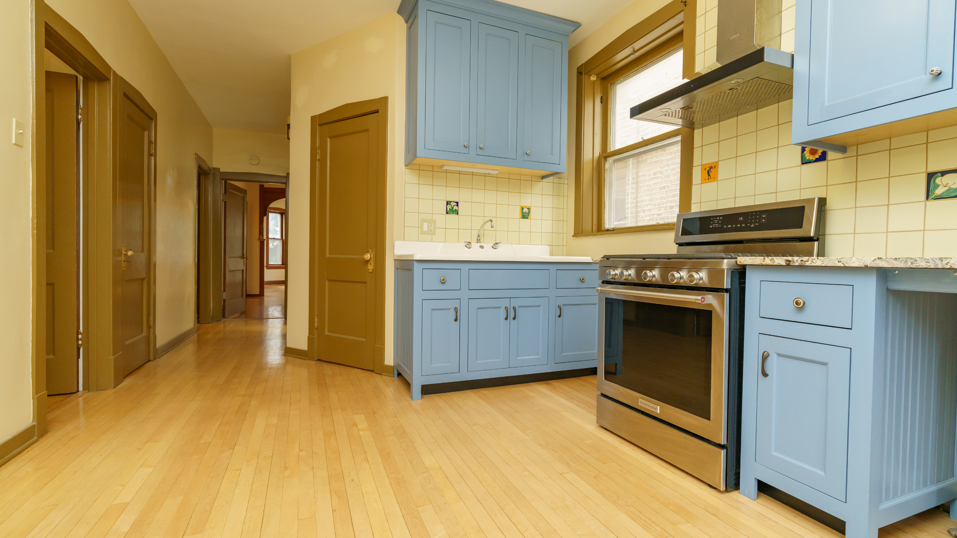 2644 North Harding Avenue Chicago, IL 60647 - Photo 9 of 37 a kitchen with stainless steel appliances granite countertop a stove a sink and a refrigerator