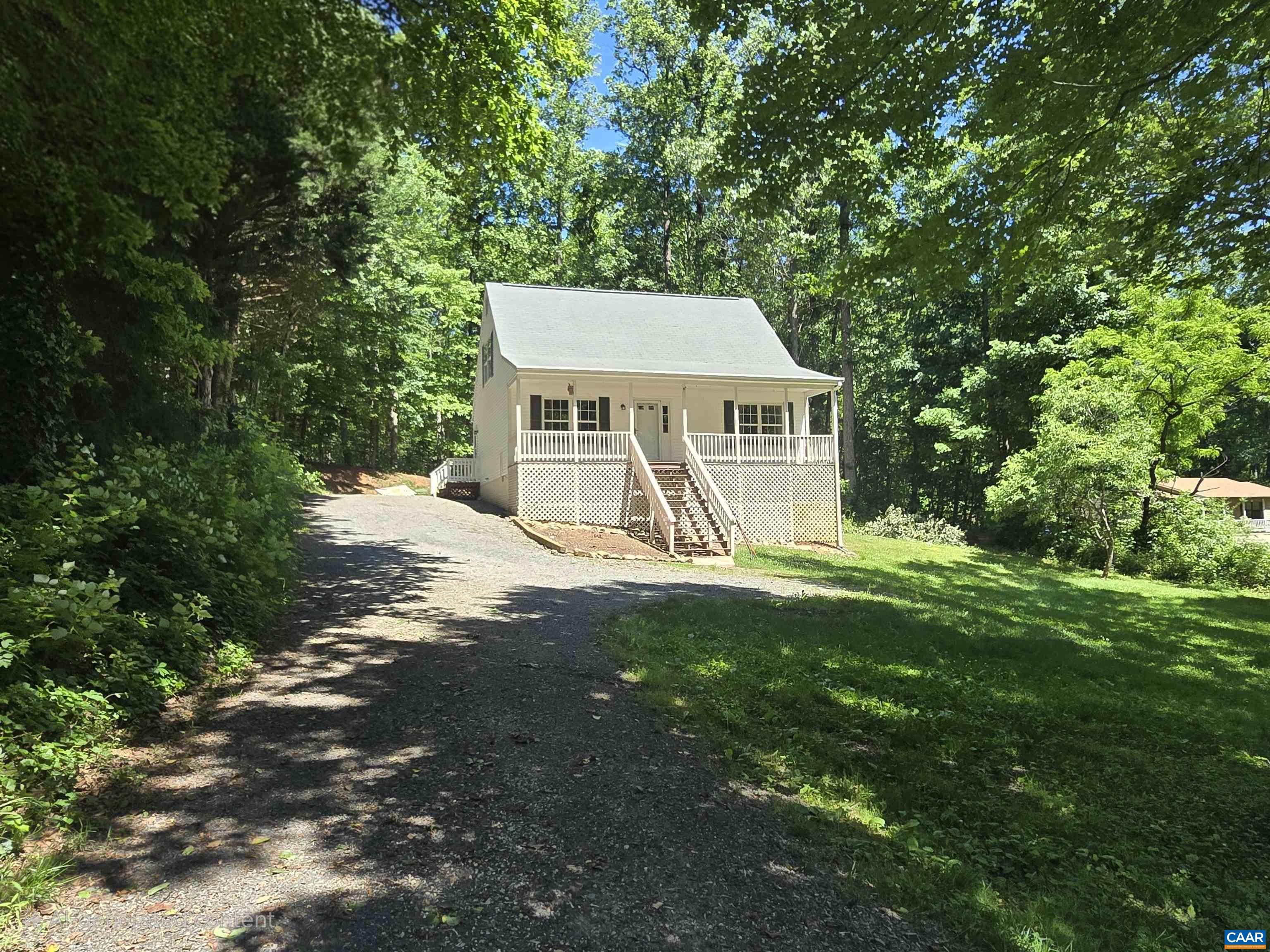 79 Haney Road Ruckersville, VA 22968 - Photo 1 of 15 front view of a house with a yard