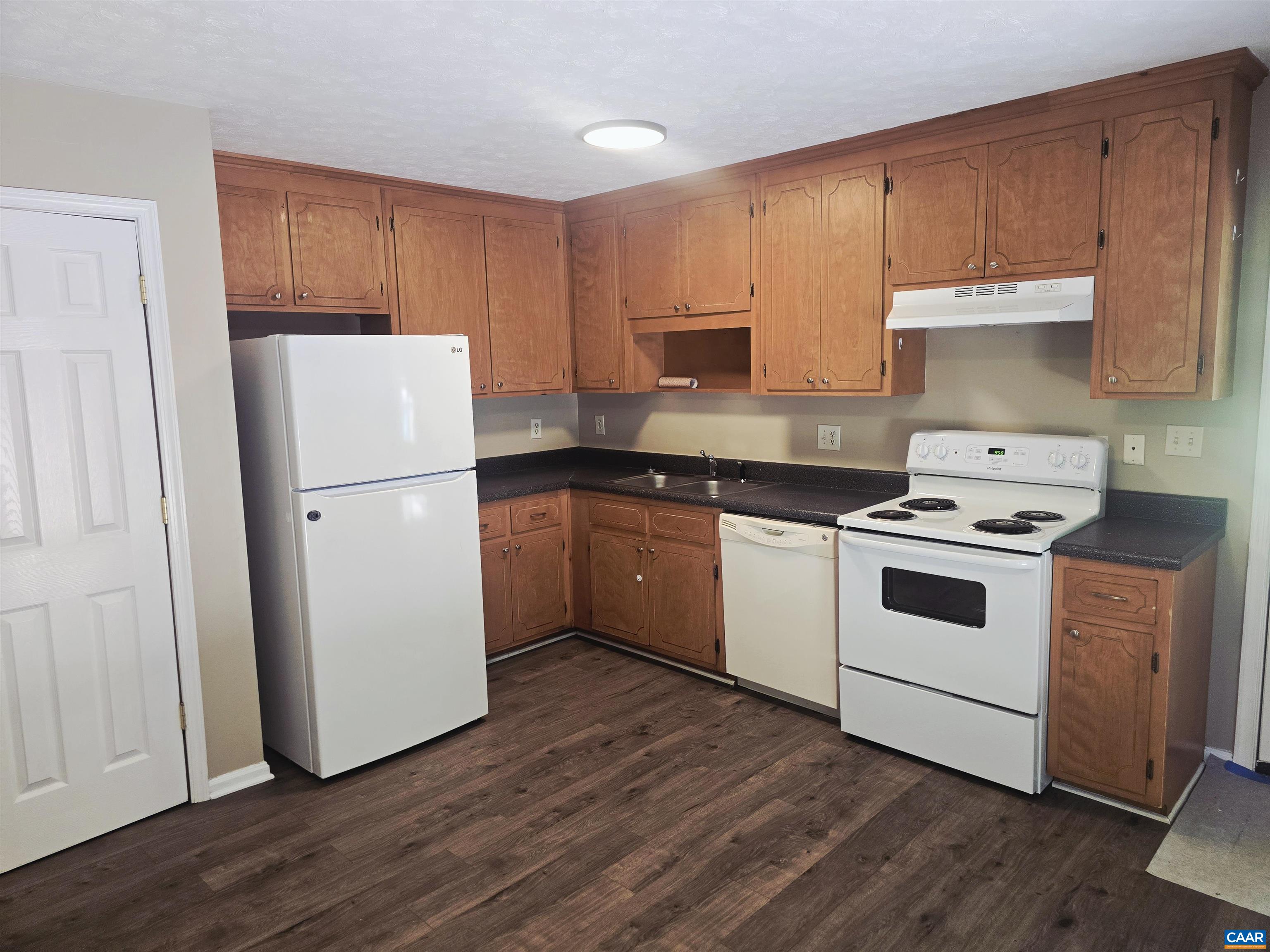 79 Haney Road Ruckersville, VA 22968 - Photo 8 of 15 a kitchen with a white cabinets and white appliances