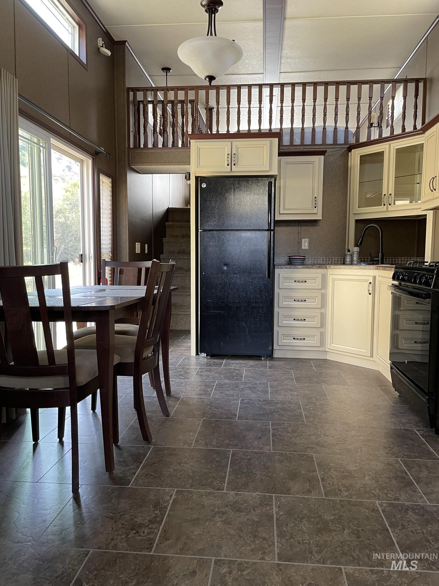 532 Old Pollock Road Riggins, ID 83549 - Photo 13 of 25 Dining area with stone tile flooring and a high ceiling