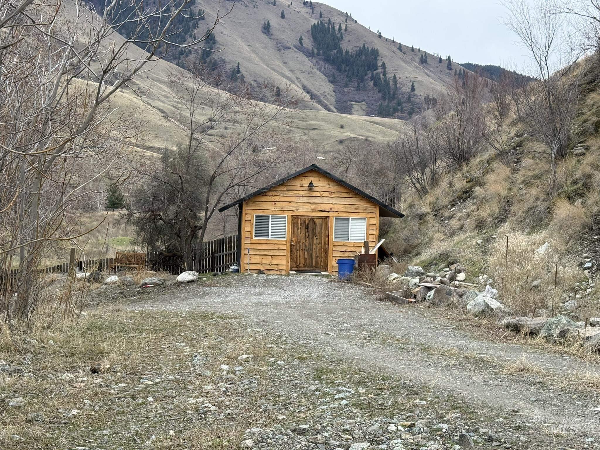 532 Old Pollock Road Riggins, ID 83549 - Photo 16 of 25 View of front facade with an outbuilding and a mountain view