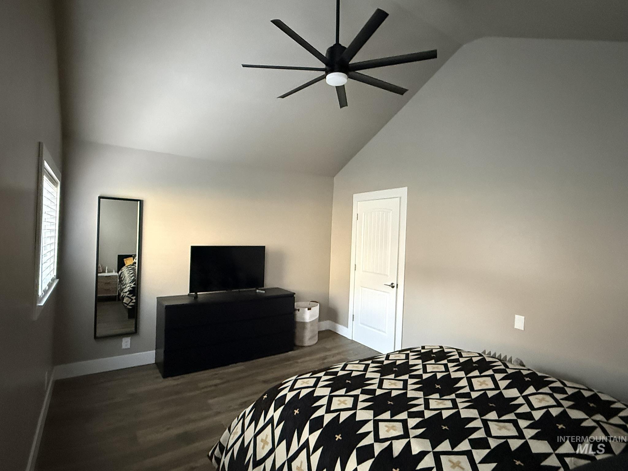 532 Old Pollock Road Riggins, ID 83549 - Photo 22 of 25 Bedroom featuring dark wood-style floors, lofted ceiling, and a ceiling fan