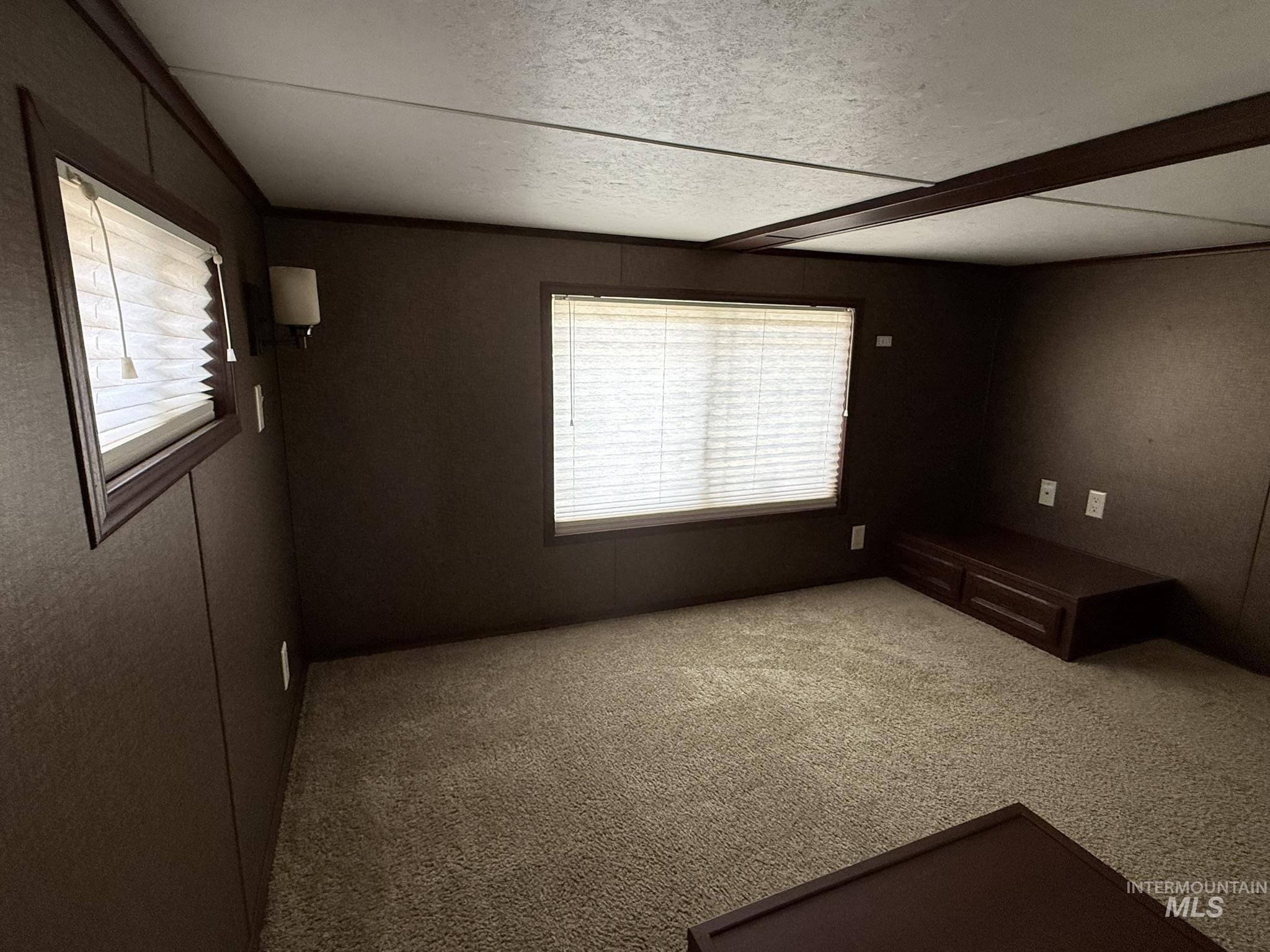 532 Old Pollock Road Riggins, ID 83549 - Photo 10 of 25 Carpeted empty room featuring a textured ceiling