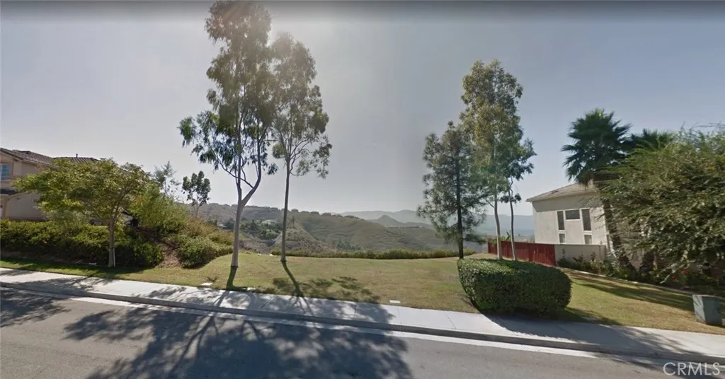 16286 Lakepointe Drive Riverside, CA 92505 - Photo 6 of 8 a view of a house with a yard