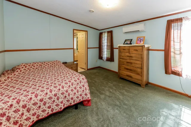 a bedroom with a bed and a cabinets