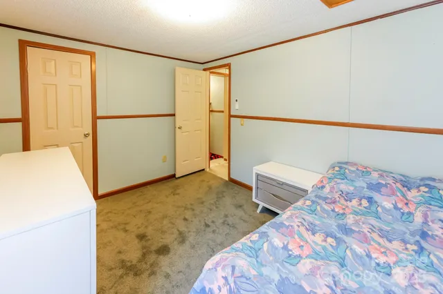 a bedroom with a bed and a cabinets
