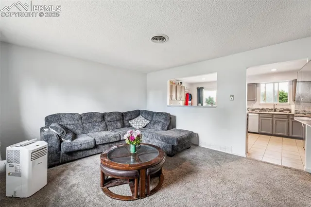 a living room with furniture and a couch