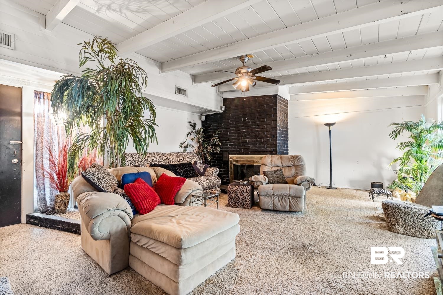 1091 Azalea Road Mobile, AL 36693 - Photo 2 of 19 Living room with carpet, beamed ceiling, a fireplace, and ceiling fan