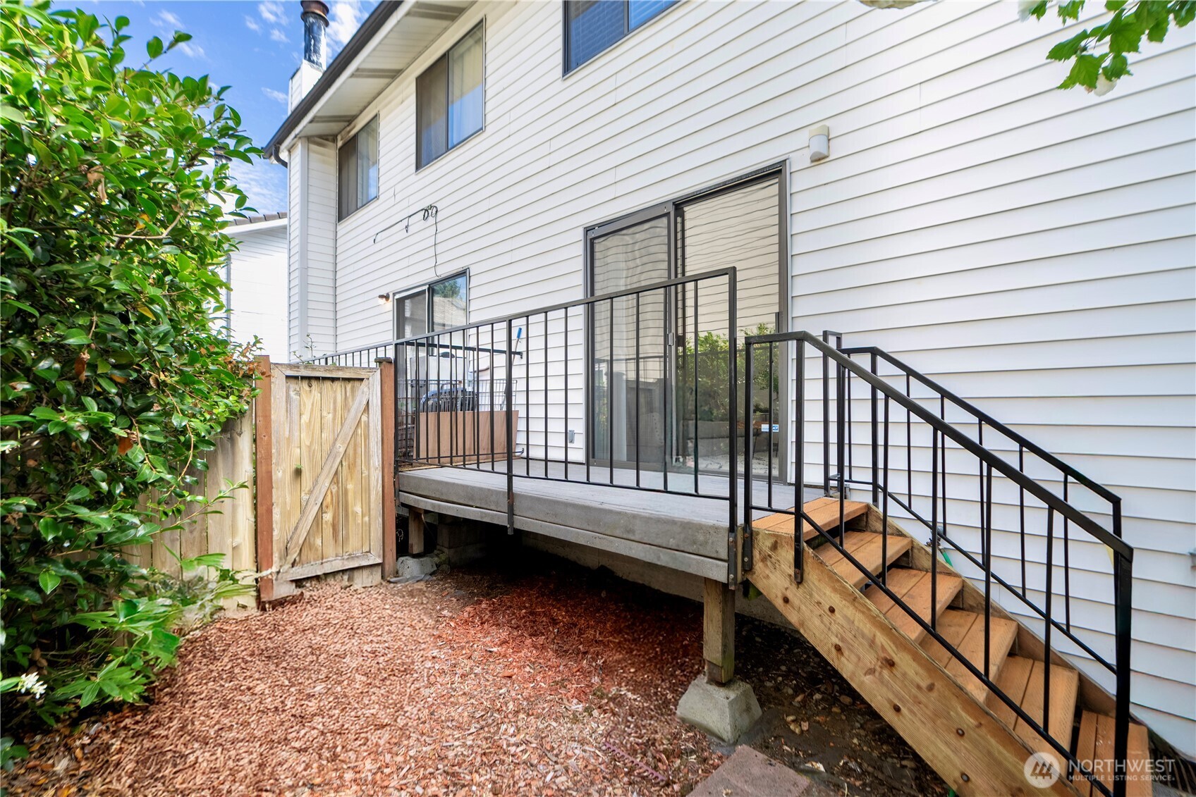 4217 Northeast 5th Street Renton, WA 98059 - Photo 13 of 24 a view of a house with backyard and deck