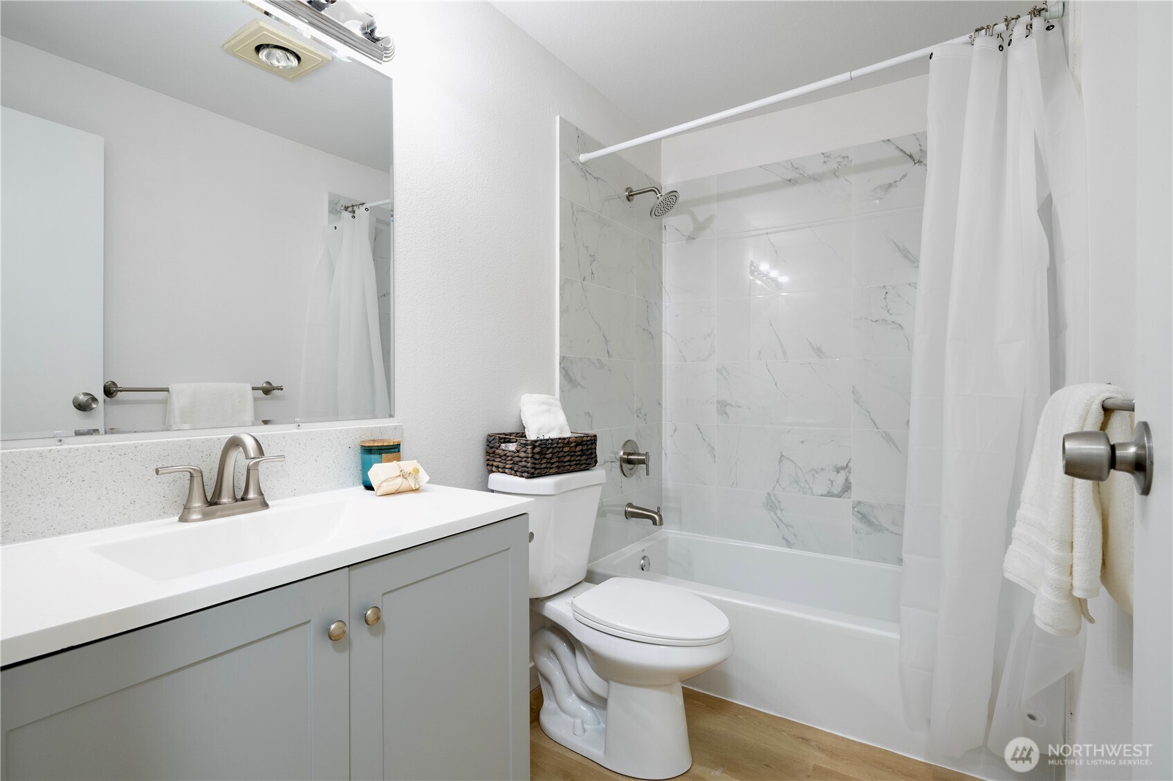 4217 Northeast 5th Street Renton, WA 98059 - Photo 23 of 24 a bathroom with a sink a toilet and shower