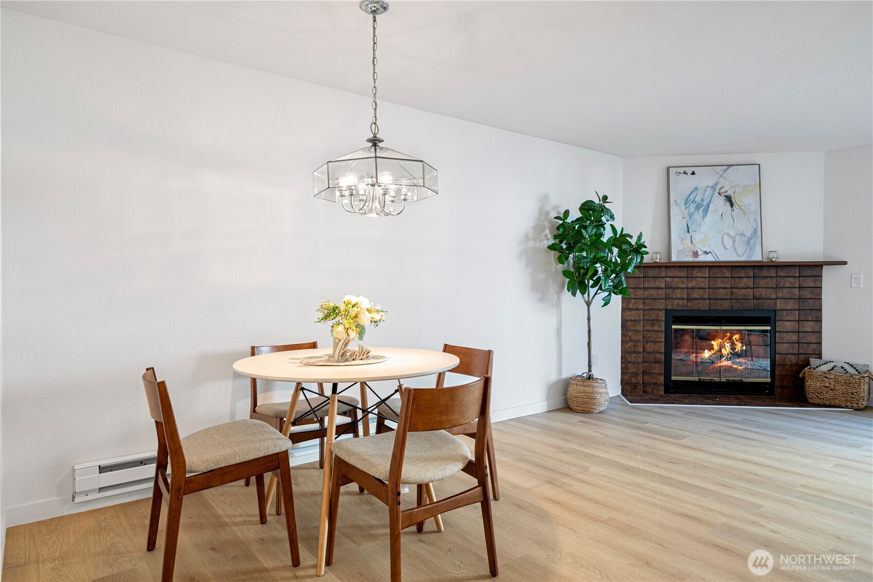 4217 Northeast 5th Street Renton, WA 98059 - Photo 7 of 24 a view of a dining room with furniture wooden floor and a chandelier