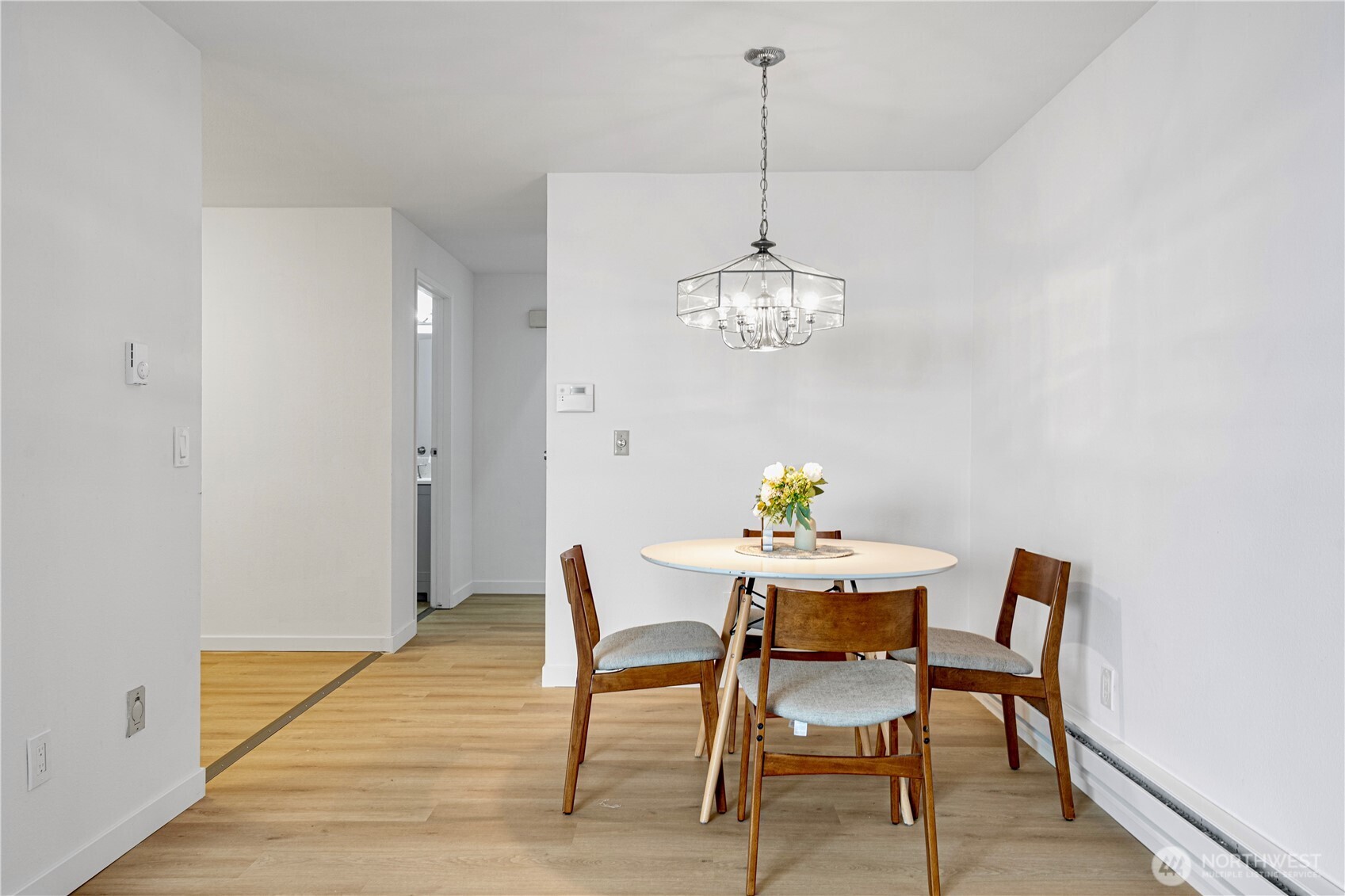 4217 Northeast 5th Street Renton, WA 98059 - Photo 8 of 24 a view of a dining room with furniture and chandelier