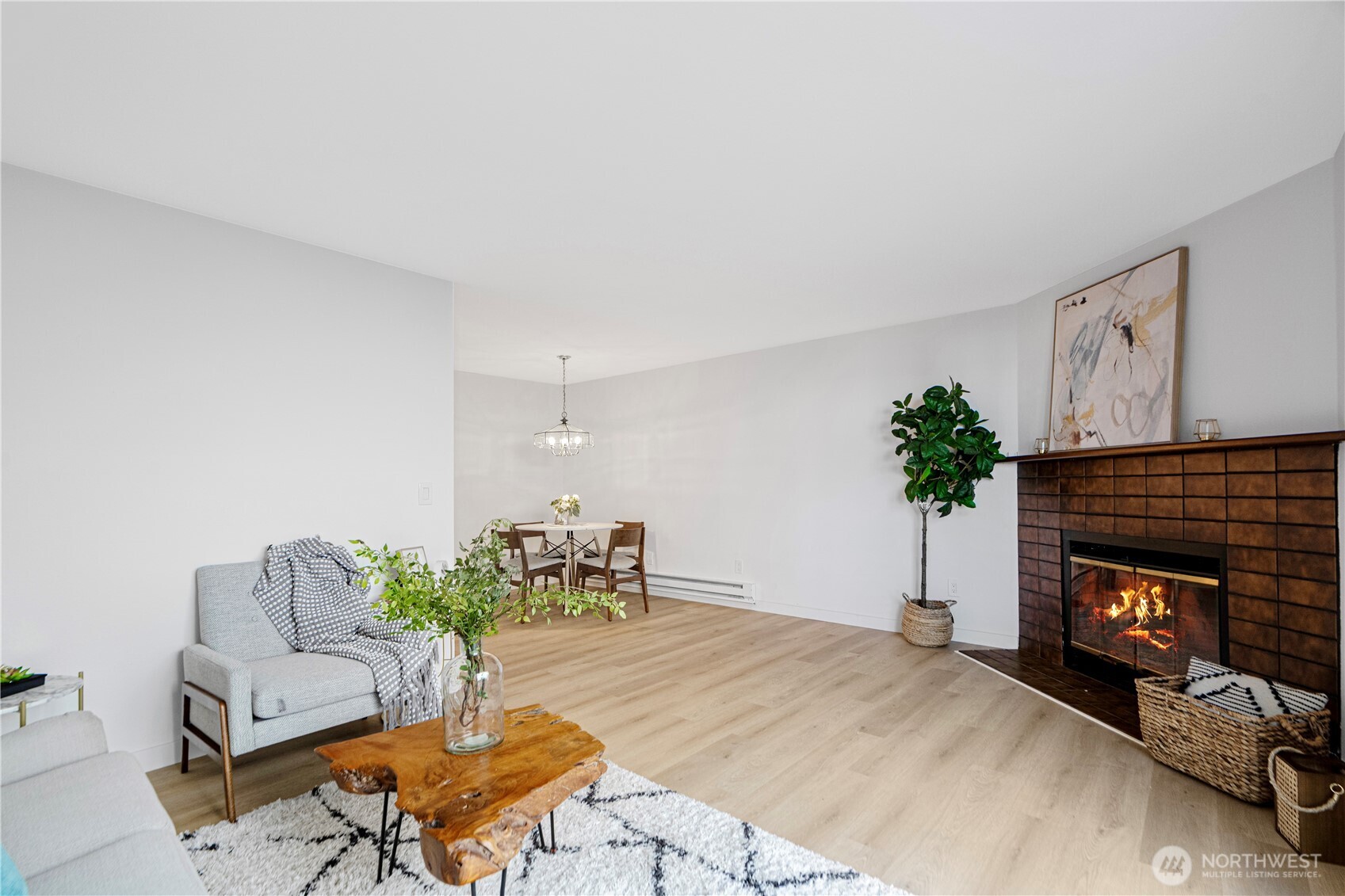 4217 Northeast 5th Street Renton, WA 98059 - Photo 10 of 24 a living room with furniture and a fireplace