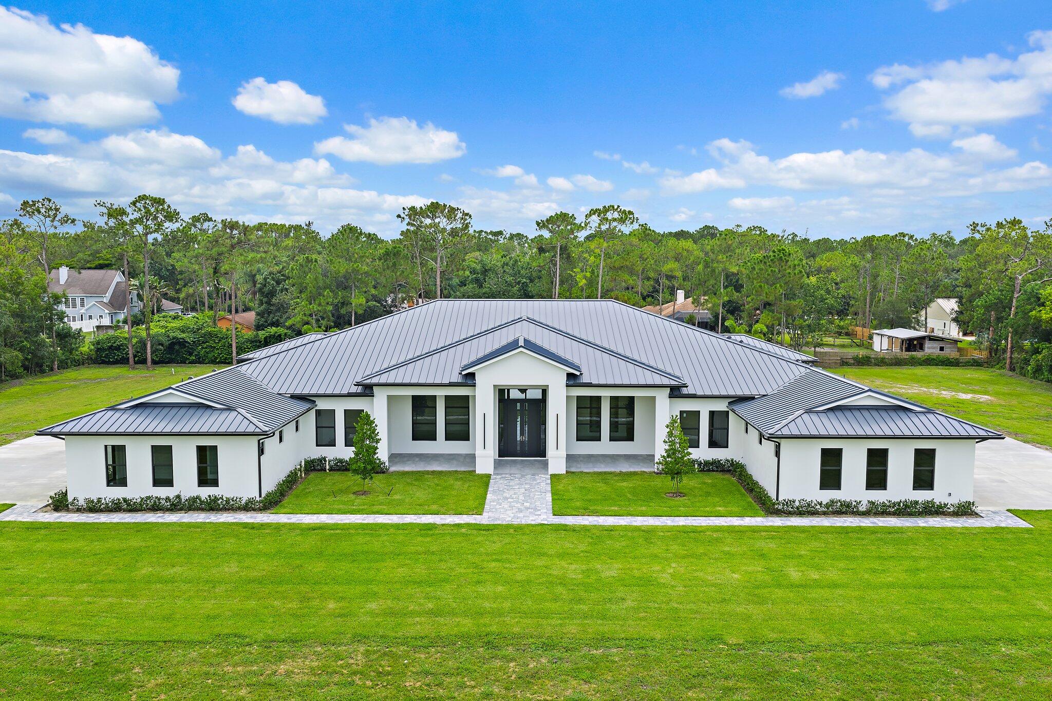 12850 152nd Street North Jupiter, FL 33478 - Photo 1 of 116 Front Exterior