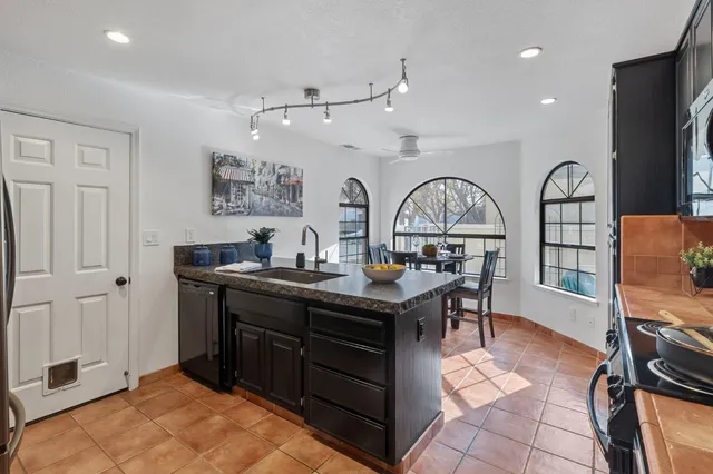 a kitchen with a stove and a microwave