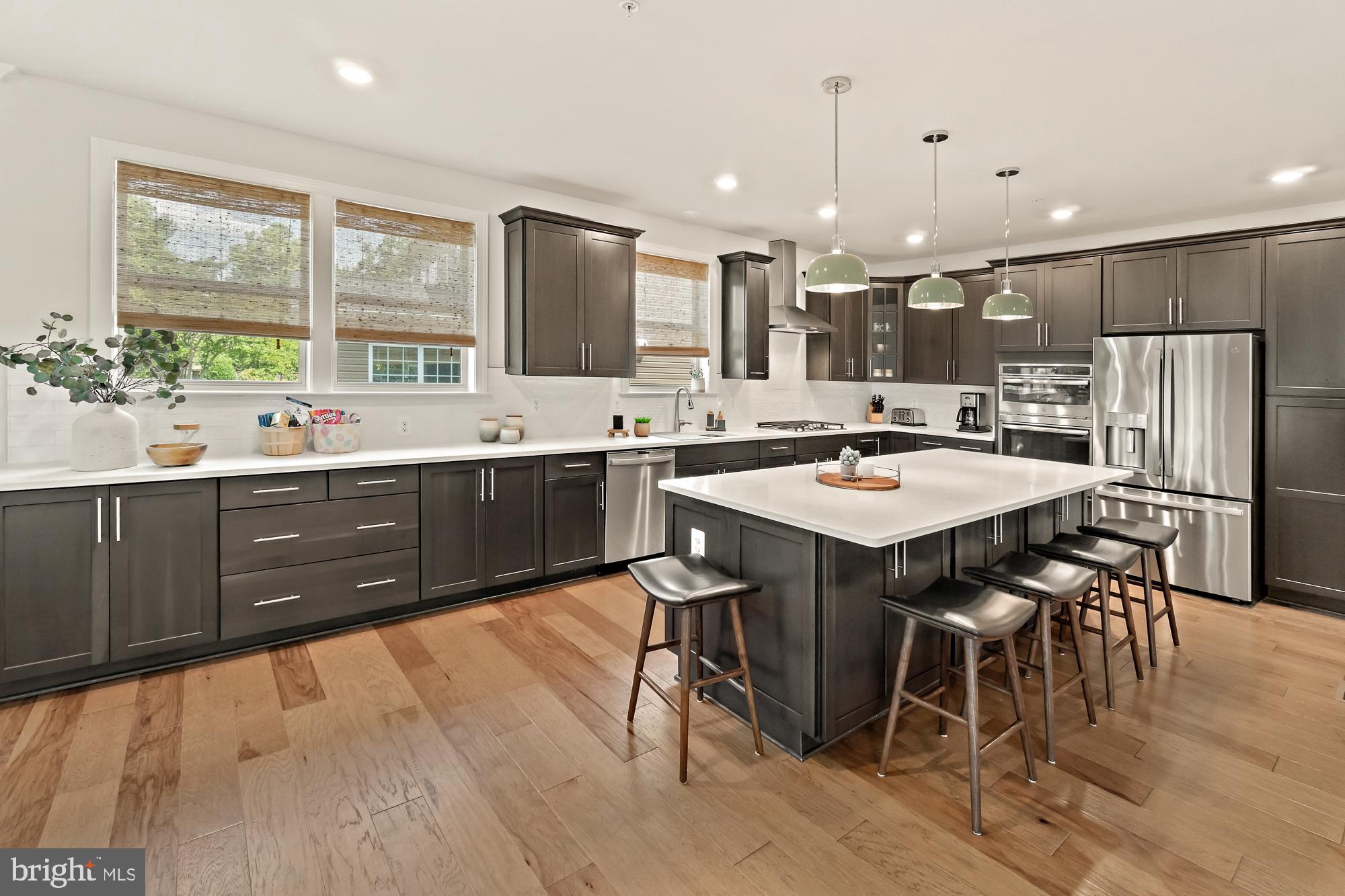 17096 Oxley Farm Road Poolesville, MD 20837 - Photo 23 of 88 Cabinet space EVERYWHERE in this modern kitchen!