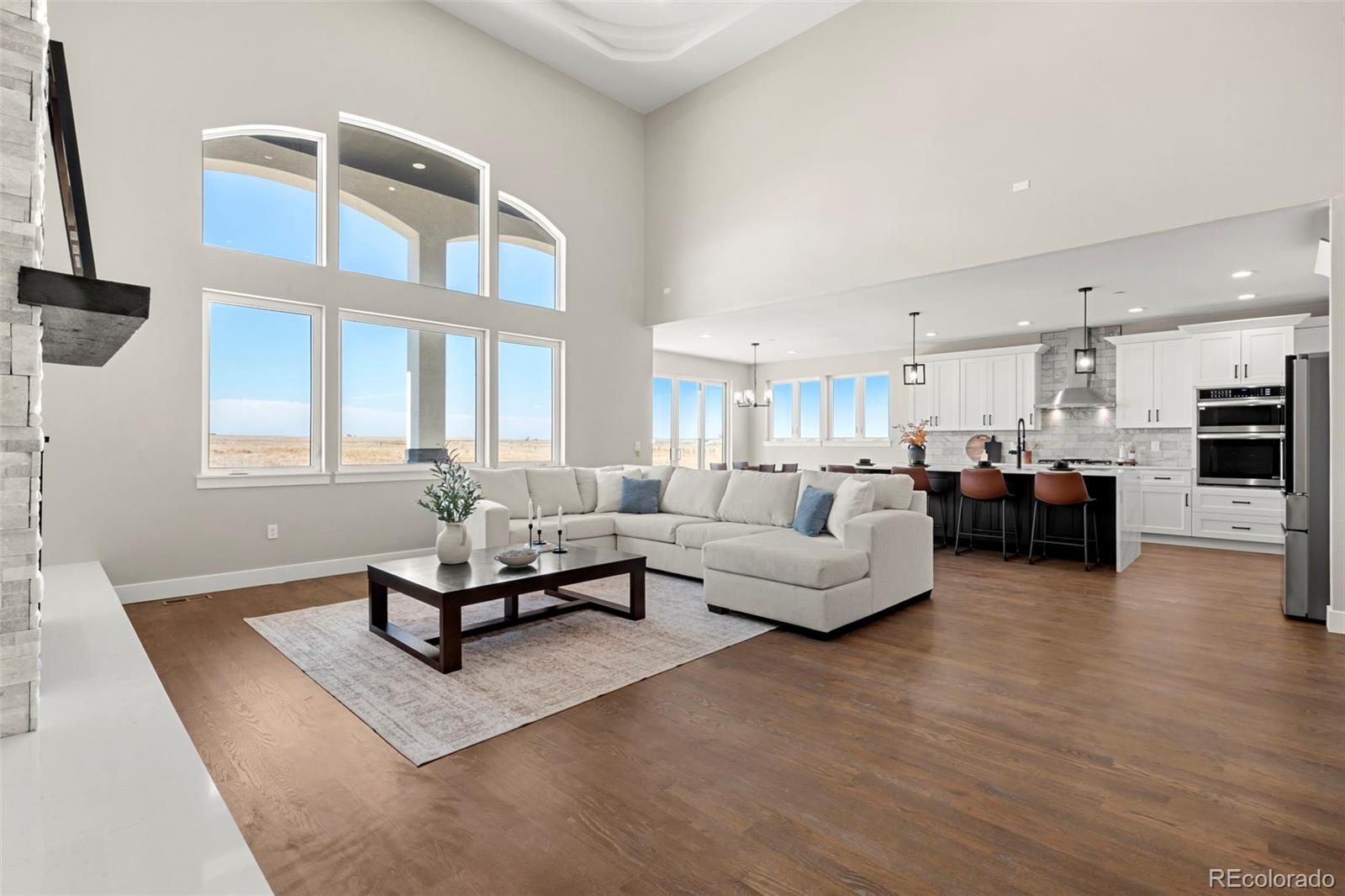 12450 Imboden Road Hudson, CO 80642 - Photo 18 of 46 a living room with furniture kitchen view and a window