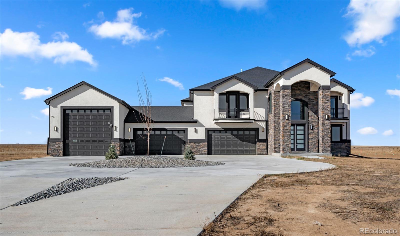 12450 Imboden Road Hudson, CO 80642 - Photo 2 of 46 a front view of a house with a yard