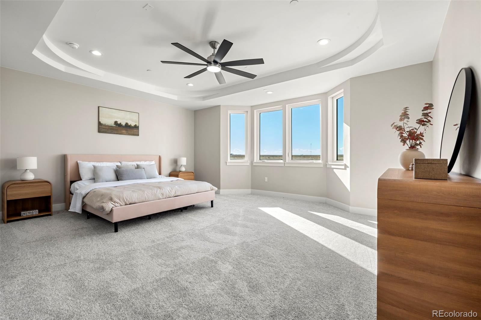 12450 Imboden Road Hudson, CO 80642 - Photo 21 of 46 a spacious bedroom with a bed couch and window