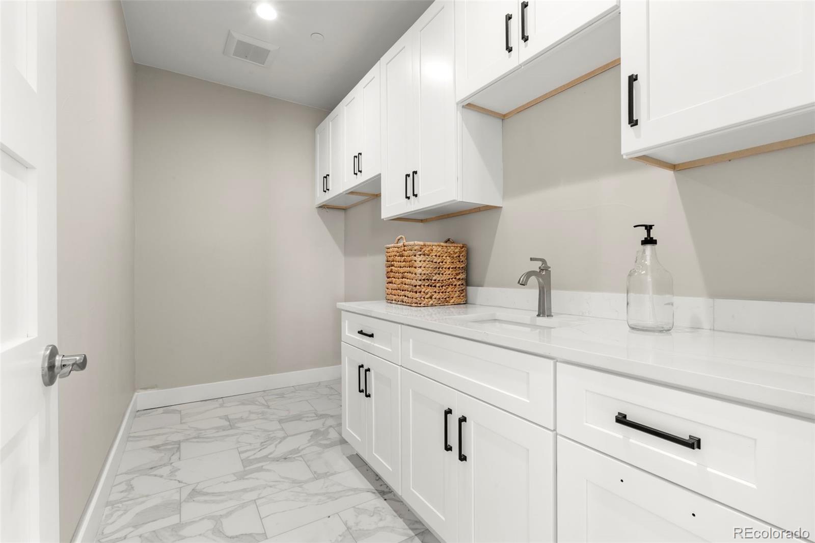 12450 Imboden Road Hudson, CO 80642 - Photo 31 of 46 a bathroom with a sink and a mirror