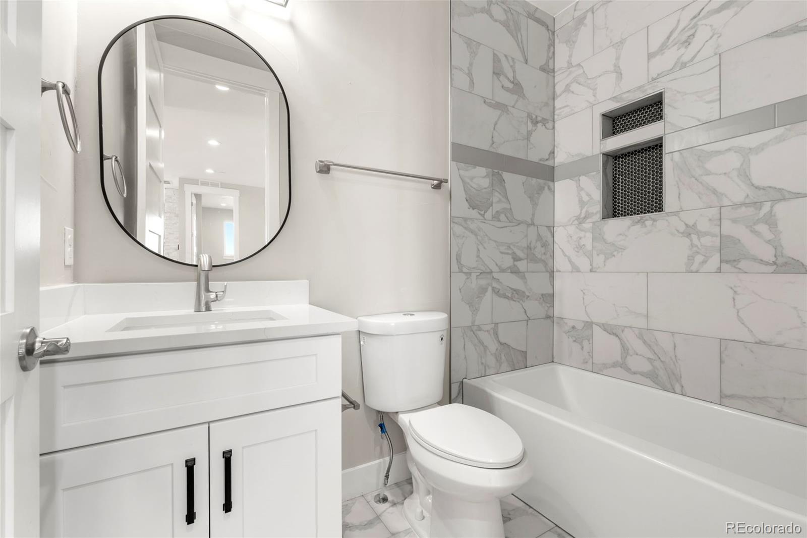 12450 Imboden Road Hudson, CO 80642 - Photo 34 of 46 a bathroom with a sink a toilet and a mirror