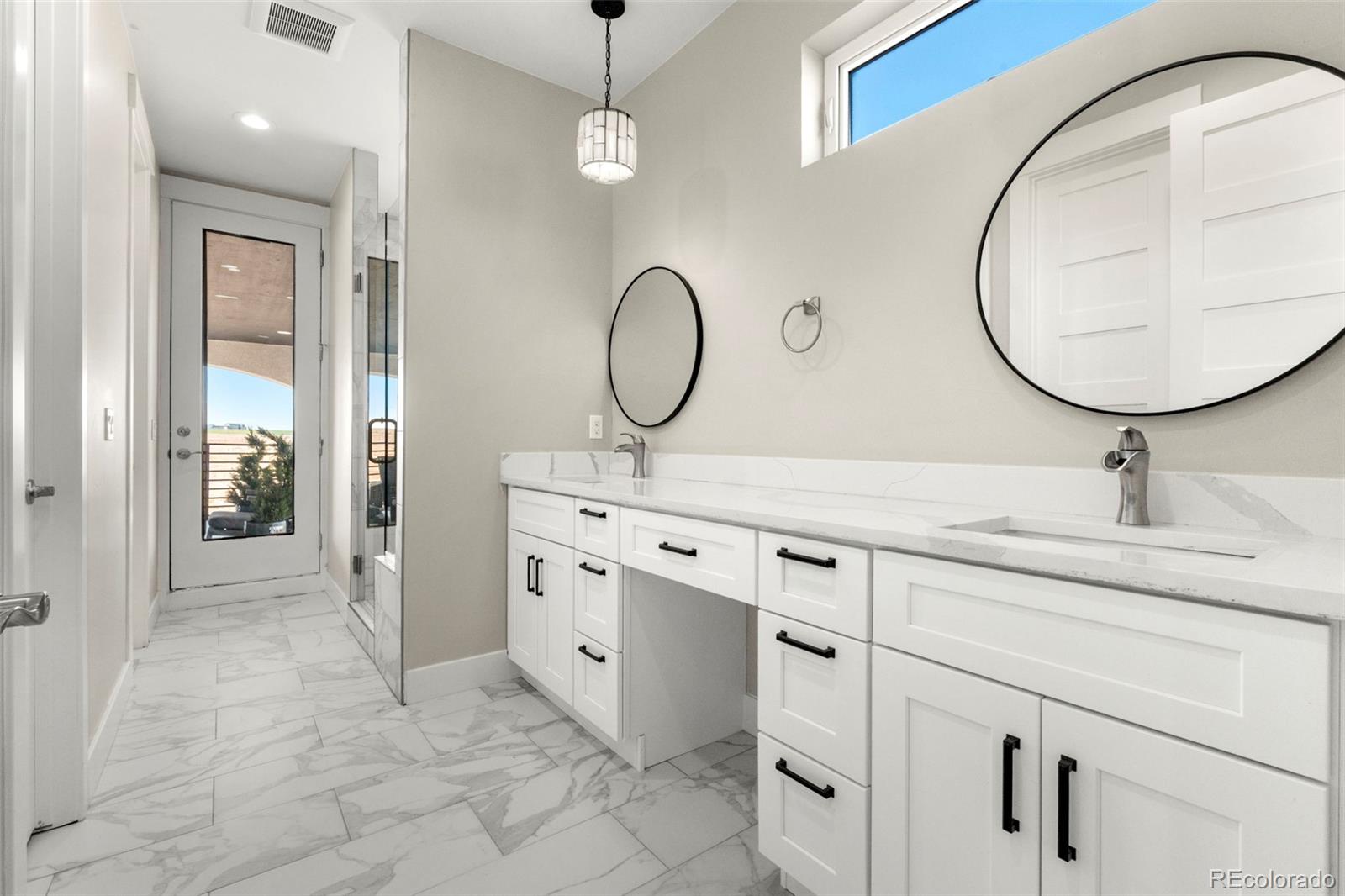 12450 Imboden Road Hudson, CO 80642 - Photo 39 of 46 a bathroom with a sink vanity and a mirror