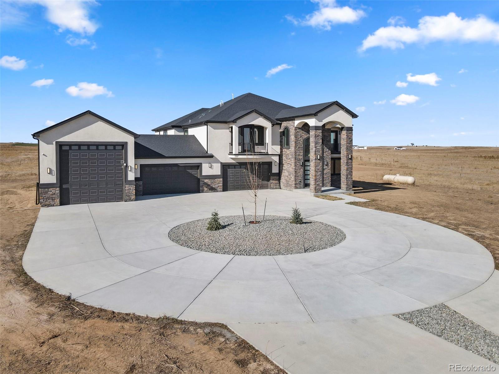12450 Imboden Road Hudson, CO 80642 - Photo 4 of 46 a front view of a house with a yard