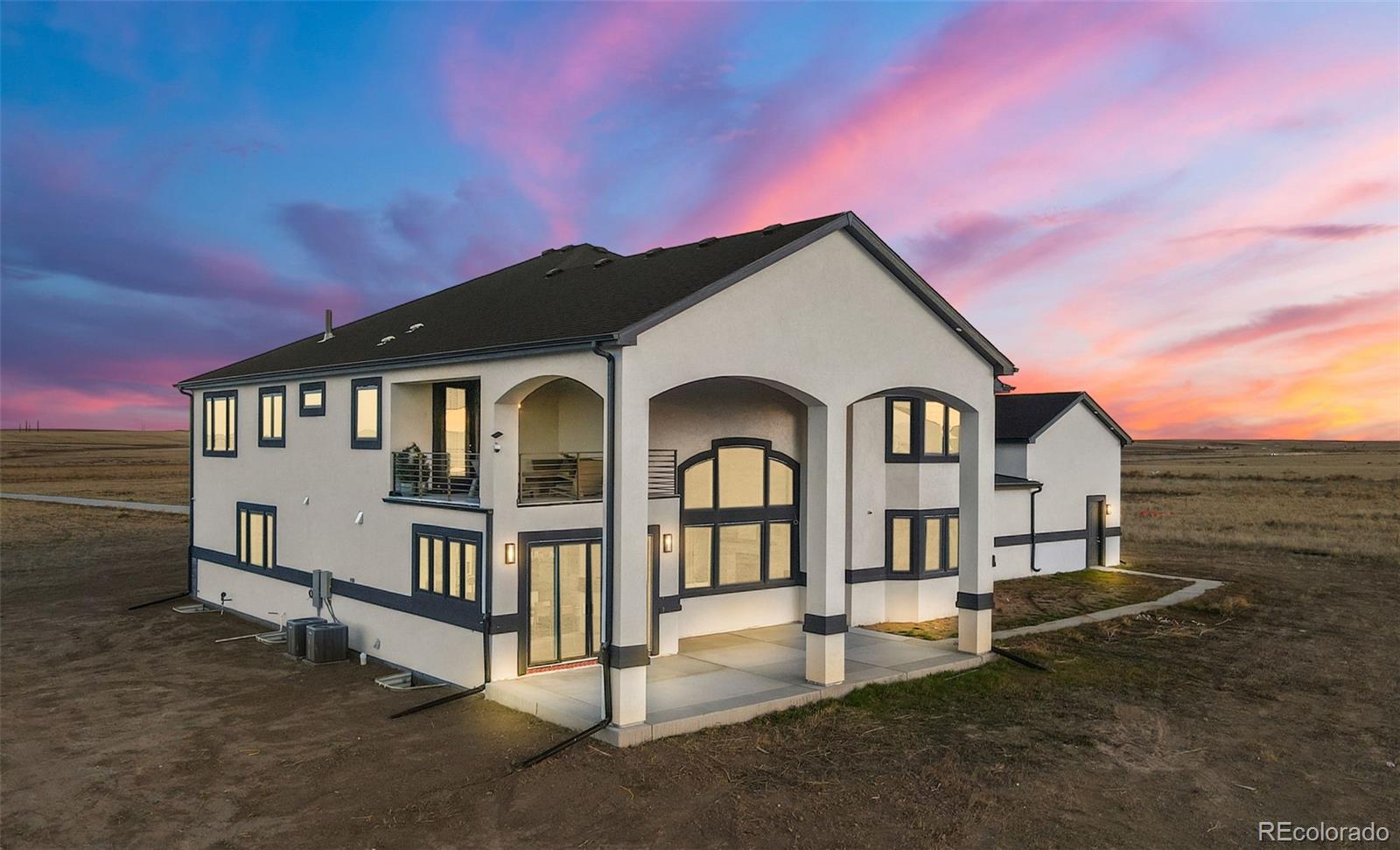 12450 Imboden Road Hudson, CO 80642 - Photo 46 of 46 a front view of a house with yard and parking space