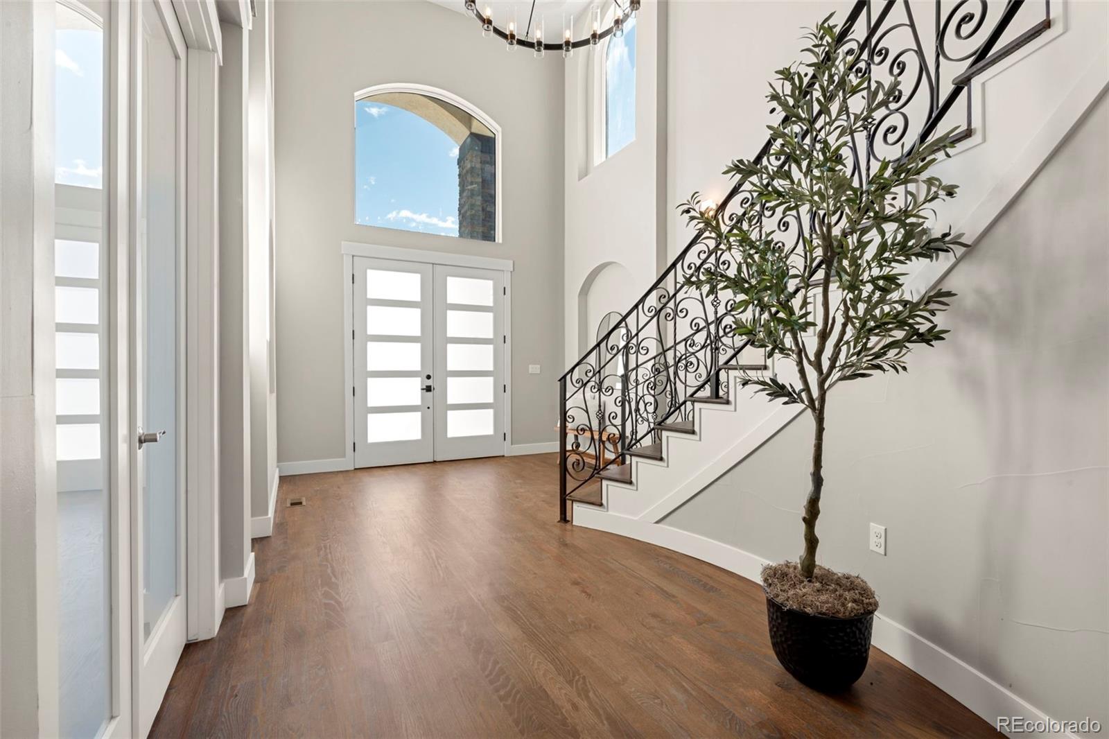 12450 Imboden Road Hudson, CO 80642 - Photo 5 of 46 a view of a hallway with wooden floor and entryway