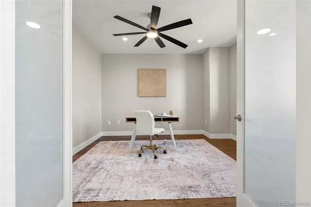 a room with furniture and view of bathroom