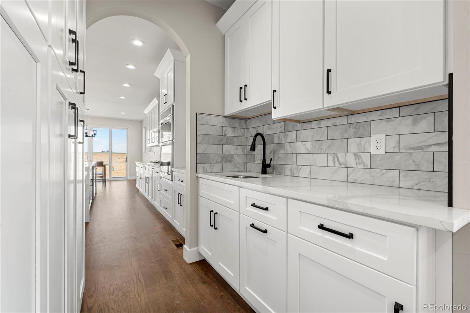 12450 Imboden Road Hudson, CO 80642 - Photo 8 of 46 a view of a kitchen with electric appliances