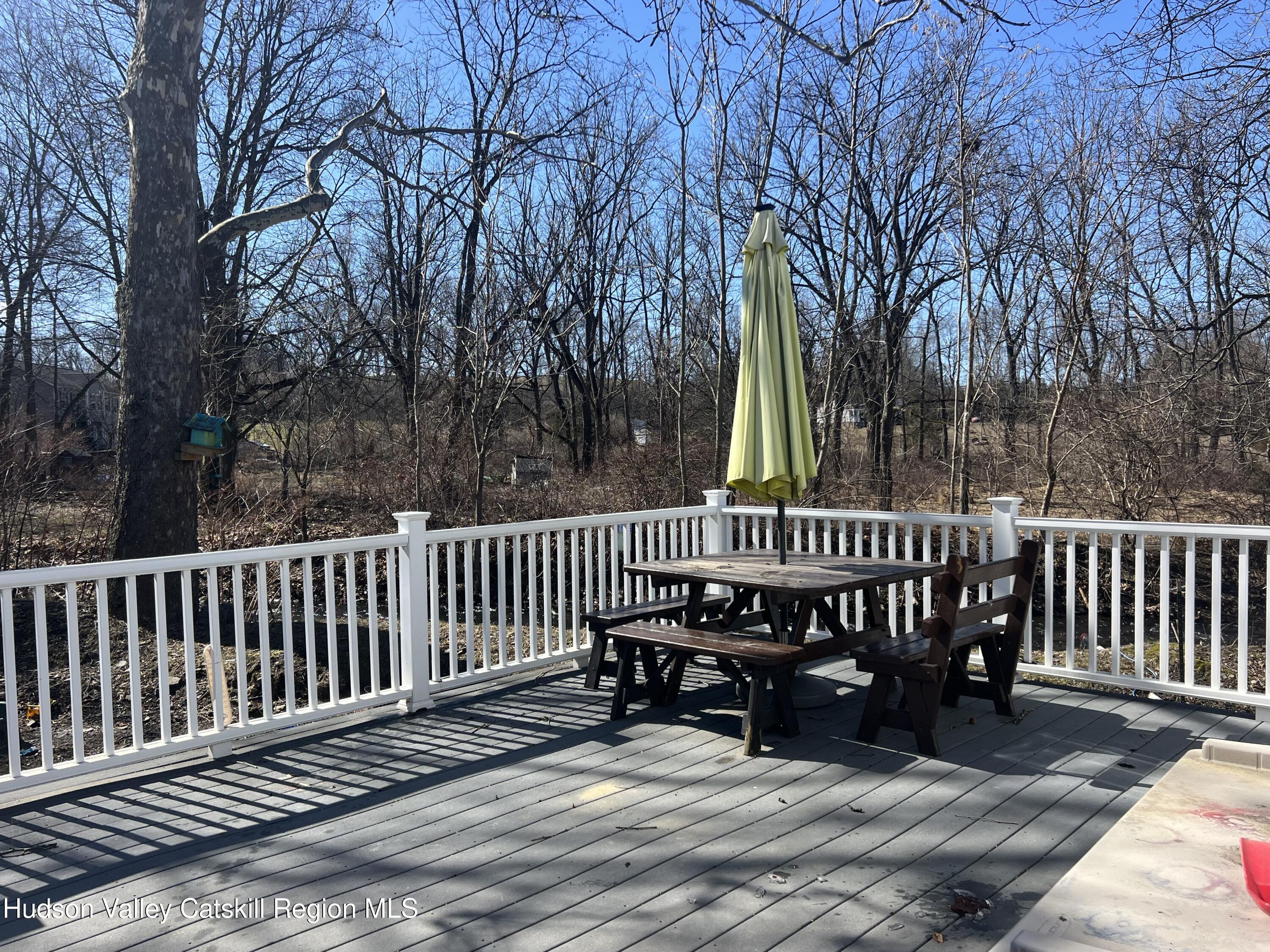 168 County Route Hudson, NY 12534 - Photo 13 of 20 a view of a wooden deck with chairs and a yard