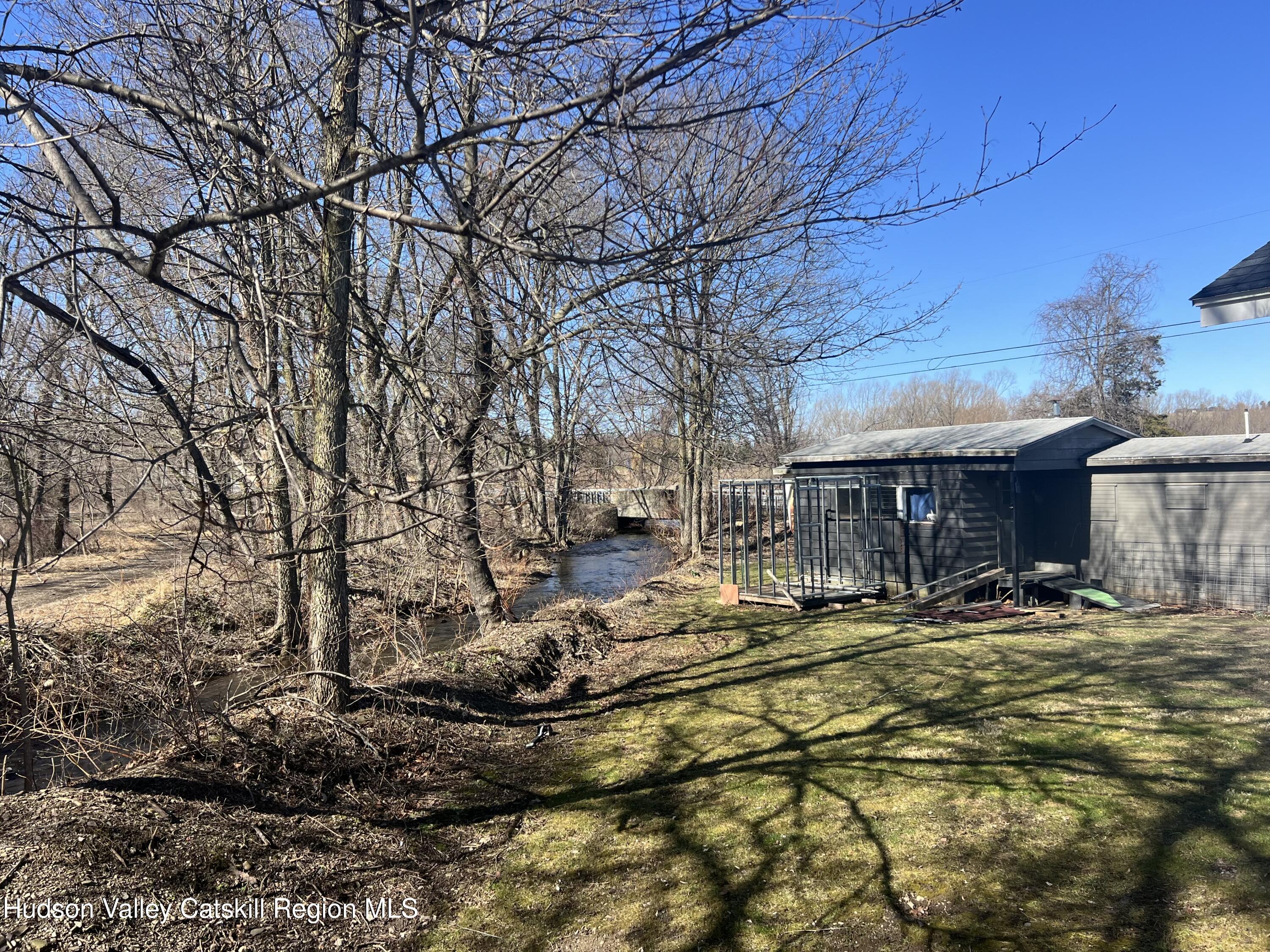168 County Route Hudson, NY 12534 - Photo 19 of 20 a backyard of a house with barbeque oven and outdoor seating
