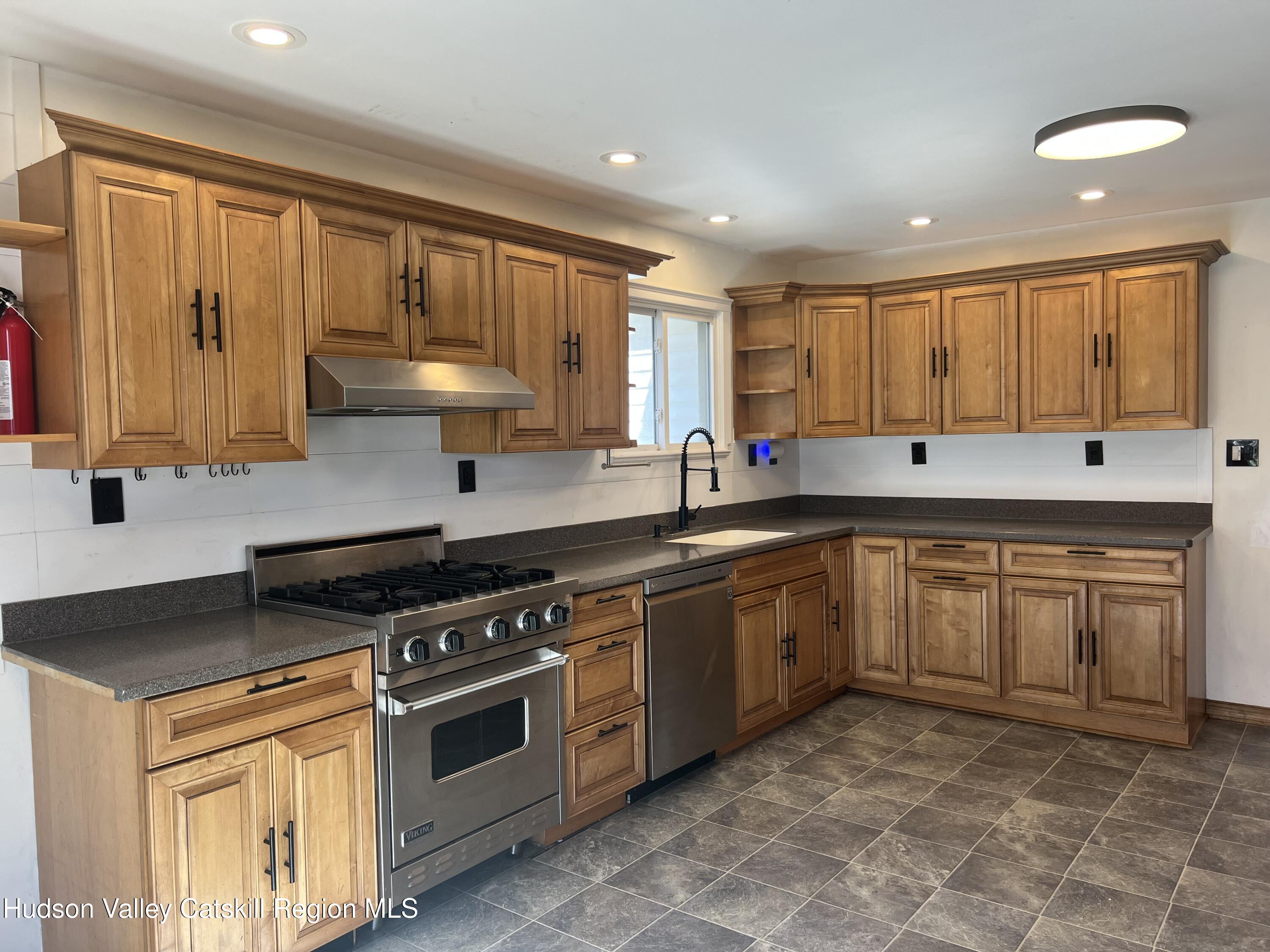 168 County Route Hudson, NY 12534 - Photo 3 of 20 a kitchen with stainless steel appliances granite countertop a stove a sink and a microwave